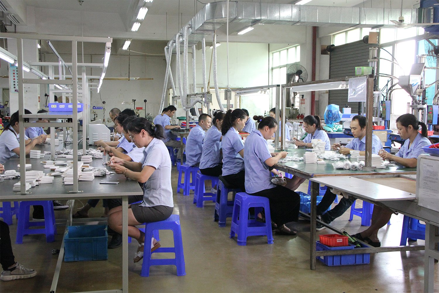 Cablum Cable wire harness assembly line with operators performing crimping and inspection